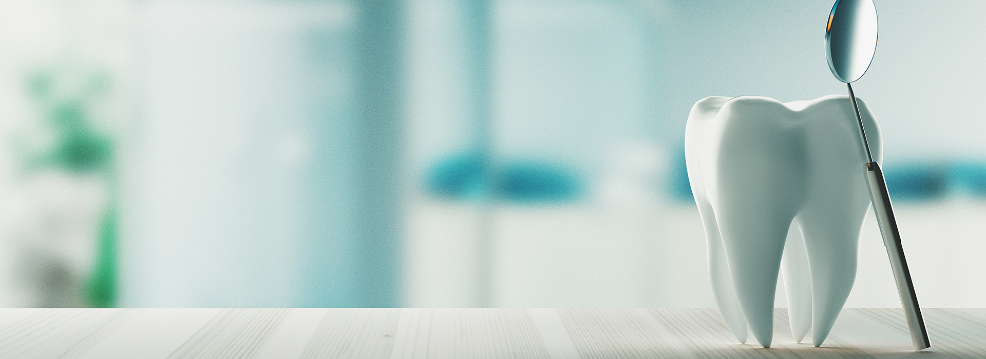 The image features a toothbrush with a toothpaste tube lying on a surface near a blurred background.